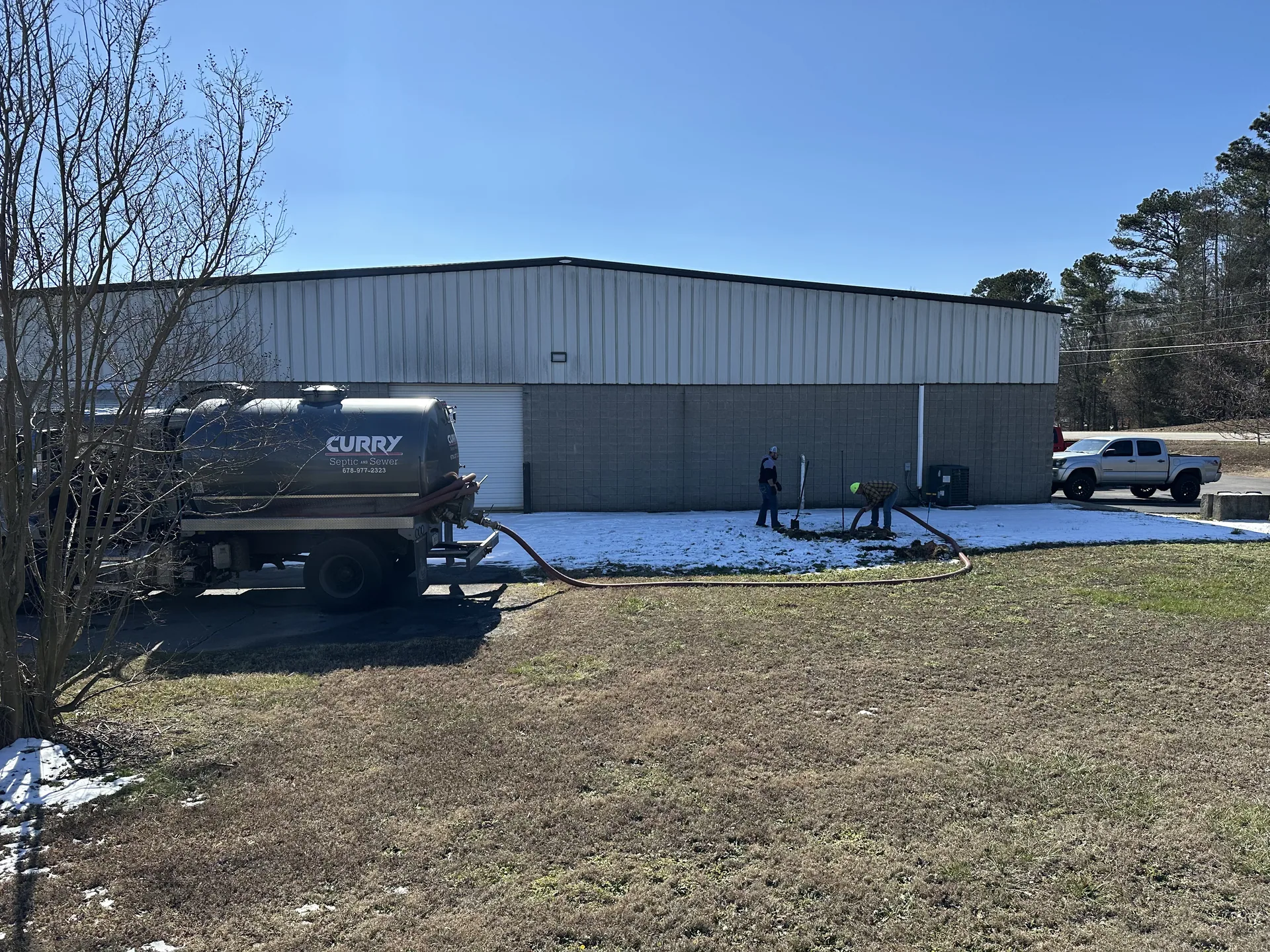 Curry Septic and Sewer crew on a job in Hoschton, GA