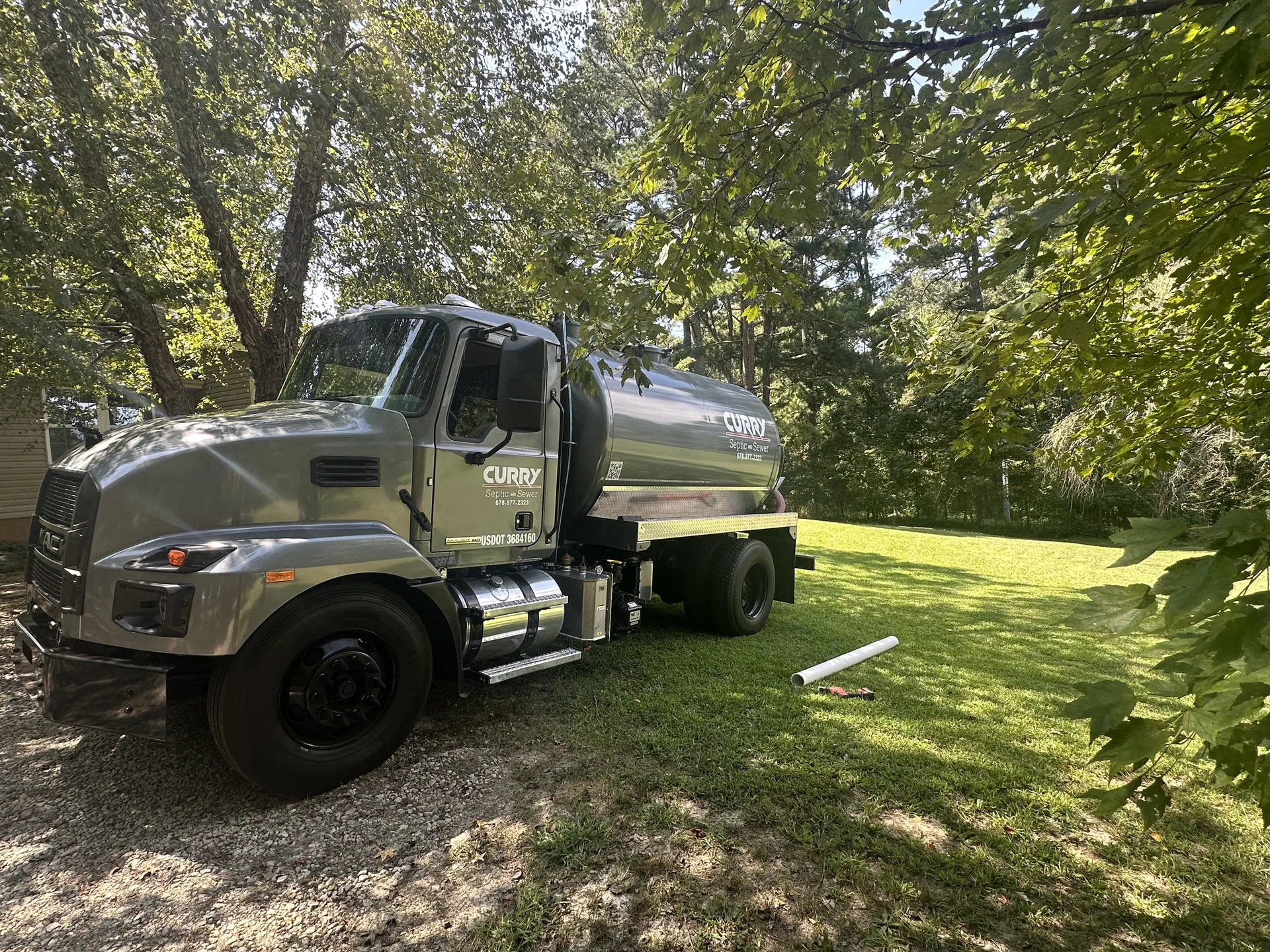 Curry septic pump truck residential yard