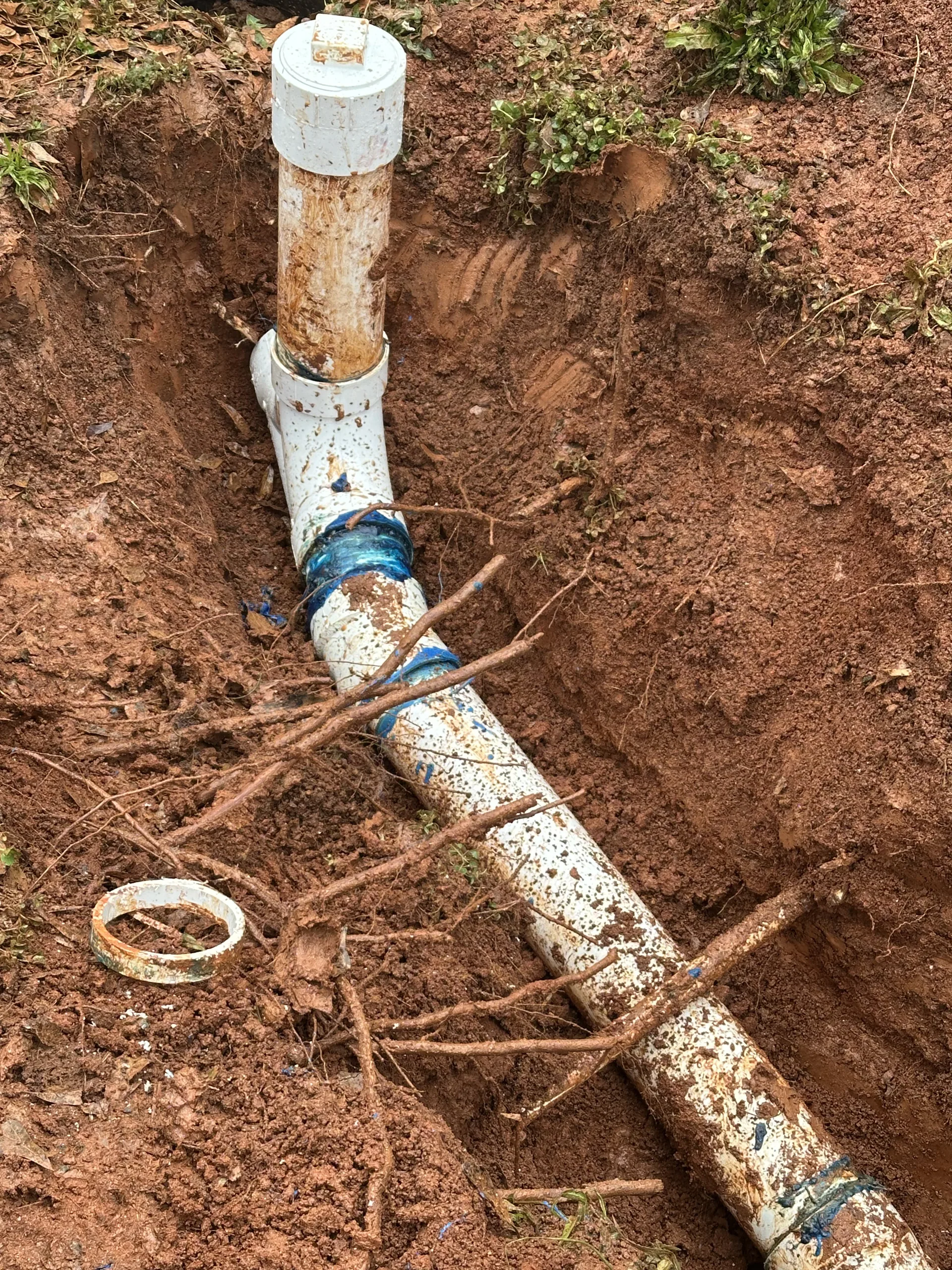 Underground pvc pipe repair excavated trench